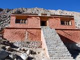 31 Dirapuk Gompa Entrance Steps On Mount Kailash Outer Kora A series of steps lead to the entrance to Dirapuk Gompa (5074m). Dirapuk takes its name from the words dira meaning female-yak-horn and puk meaning cave. The great monk Gotsangpa meditated her, supposedly from 1213 to 1217, and Buddhists say he first discovered the kora route around Kailash. He was led to Dirapuk by a yak that turned out to be the lion-faced-goddess Dakini (Tib, Khandroma), who guards the Khando Sanglam La.